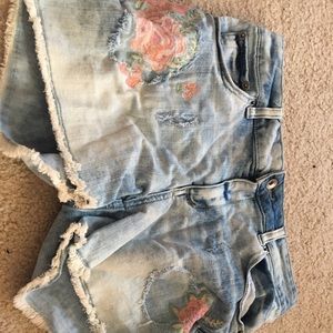 Light blue denim shorts with pink flowers